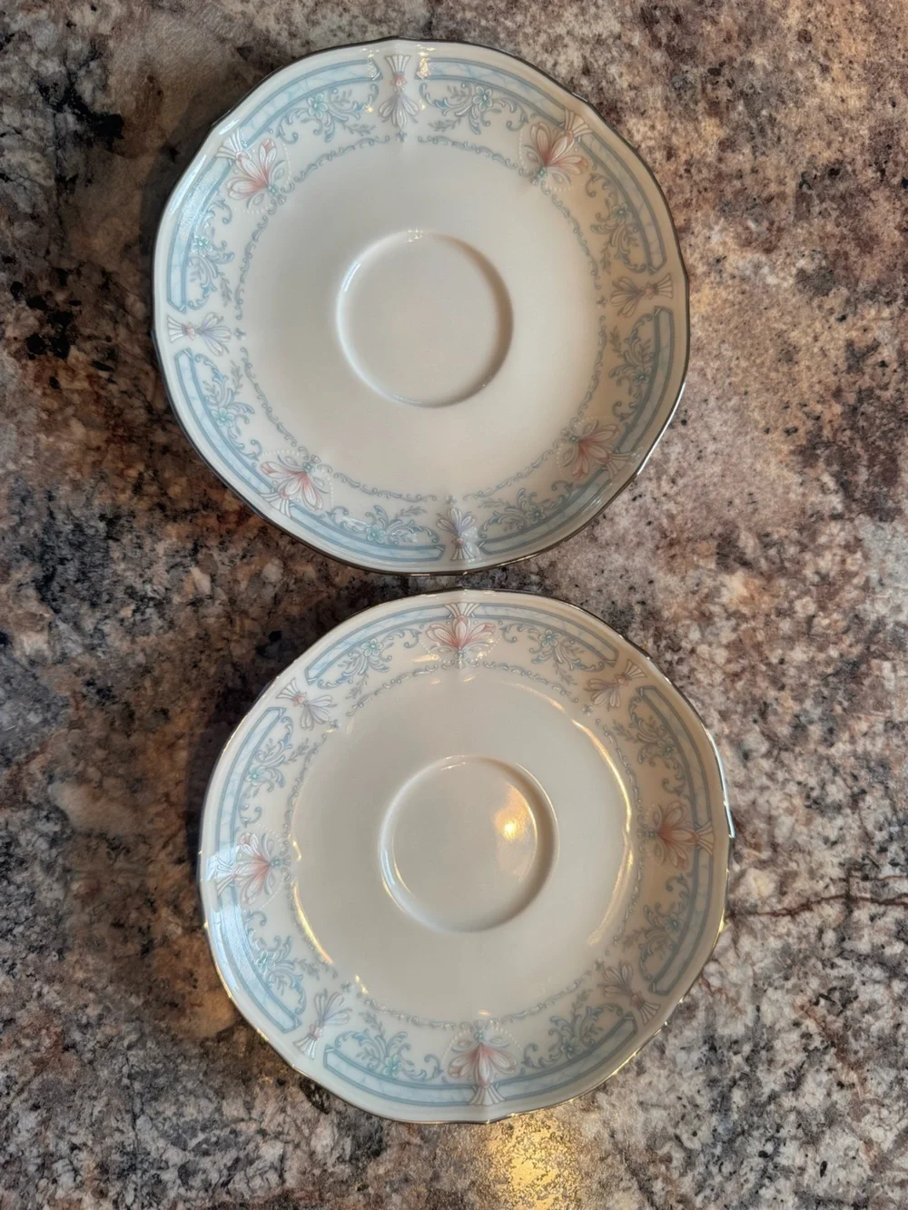 Noritake Crown Flower Dinnerware with Pale Blue and Soft Pink Floral Border